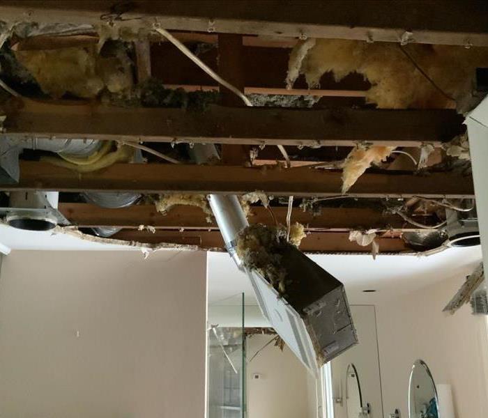 Fallen ceiling after heavy rains in a bathroom