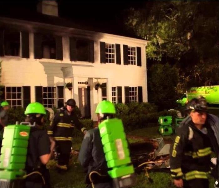 SERVPRO technicians responding to a fire with soot 