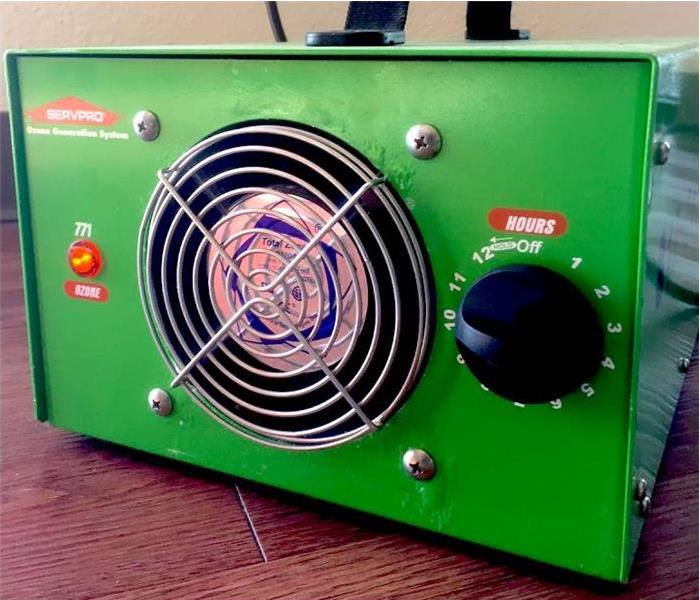 A green SERVPRO ozone machine