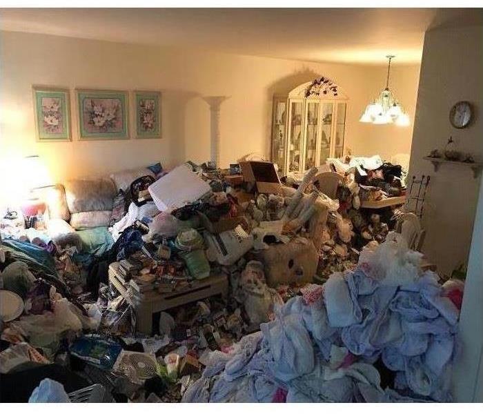 piles of things and garbage stacked up in a home